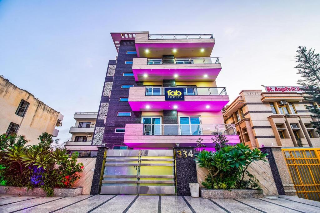 a building with pink and purple paint on it at FabHotel VR Stay in Gurgaon