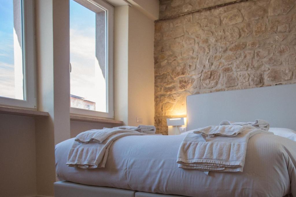Postel nebo postele na pokoji v ubytování Tre cancelli rooms