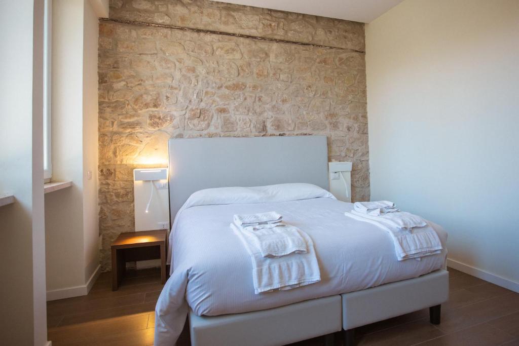 Postel nebo postele na pokoji v ubytování Tre cancelli rooms