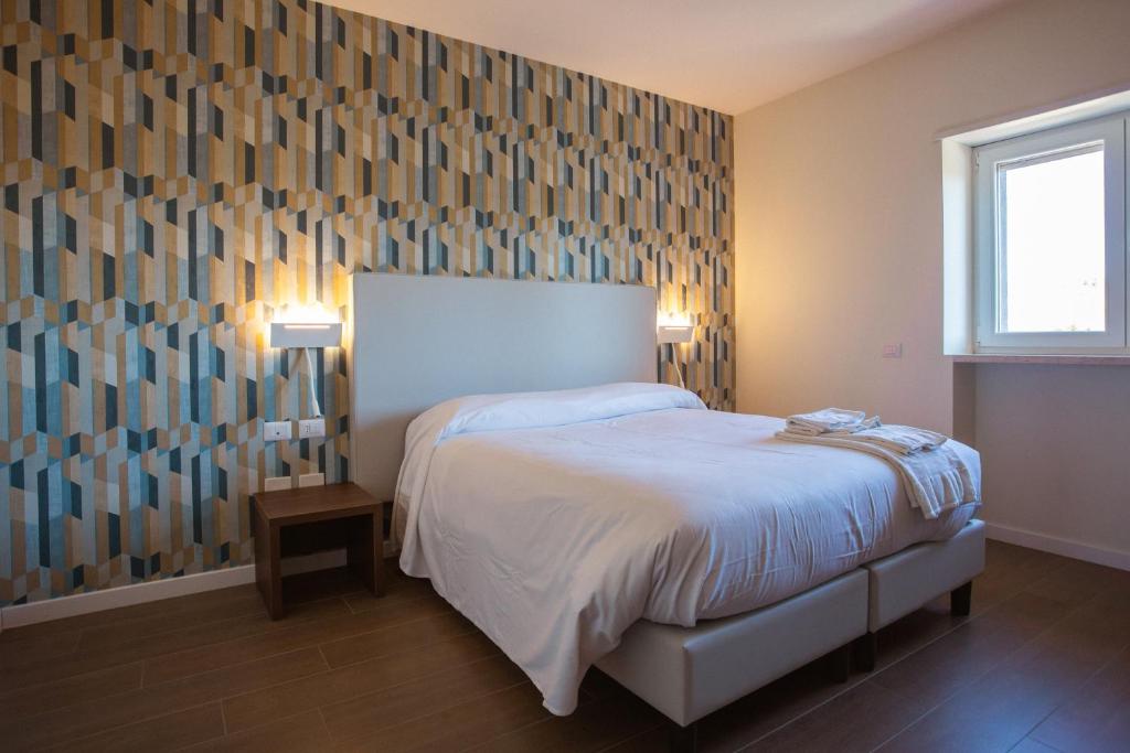 Postel nebo postele na pokoji v ubytování Tre cancelli rooms