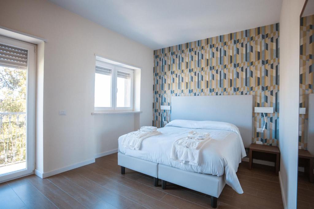 Postel nebo postele na pokoji v ubytování Tre cancelli rooms