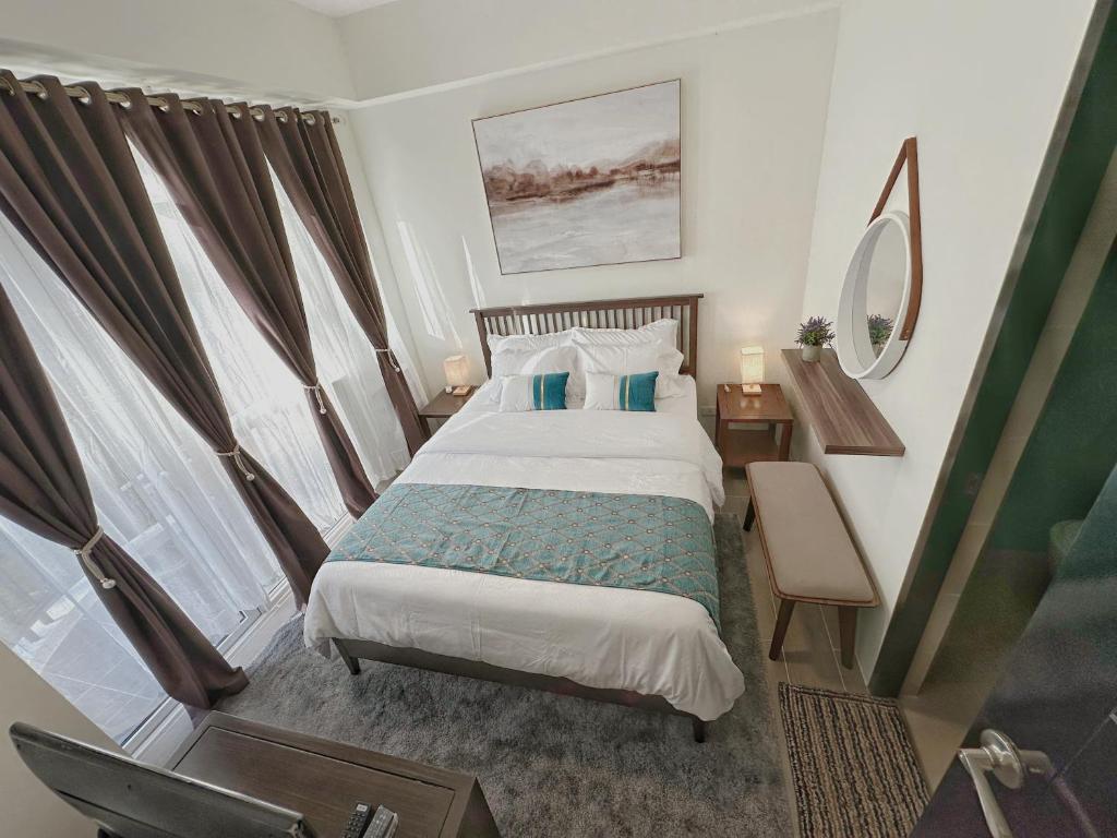 Postel nebo postele na pokoji v ubytování Coral Edge @ Boracay Newcoast