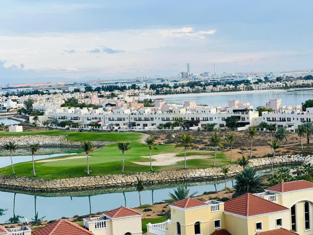 an aerial view of the golf course at the resort at luxury home royal breeze in Ras al Khaimah