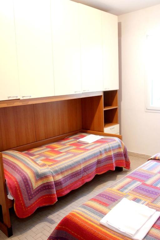 A bed or beds in a room at Primario