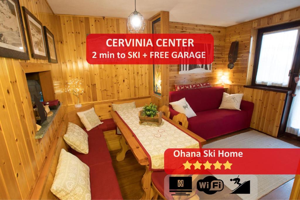 a room with a couch and a table in a room at [Cervinia Center] 2 min to SKI + FREE GARAGE in Breuil-Cervinia