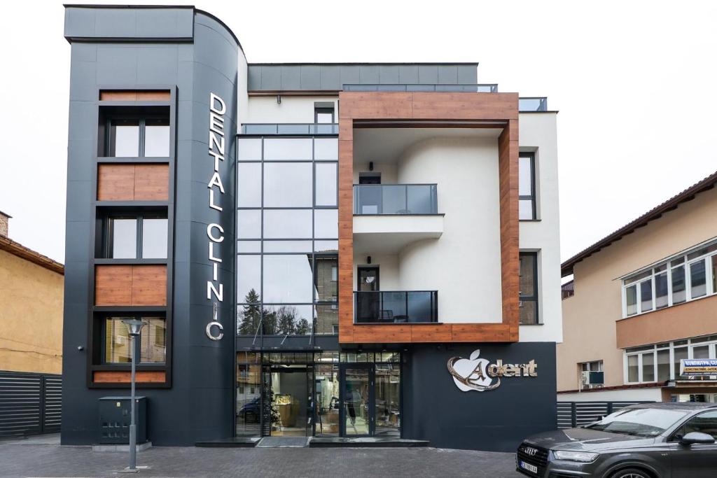 a building with a sign on the side of it at A-Dent luxury apartments & Dental Clinic in Gotse Delchev