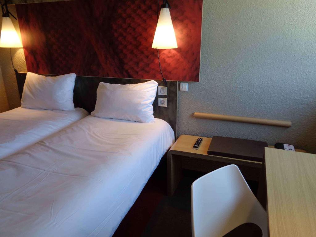 Postel nebo postele na pokoji v ubytování ibis Valence Sud