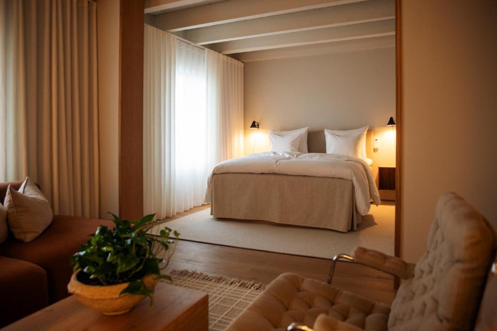 Postel nebo postele na pokoji v ubytování Hotel Vyn