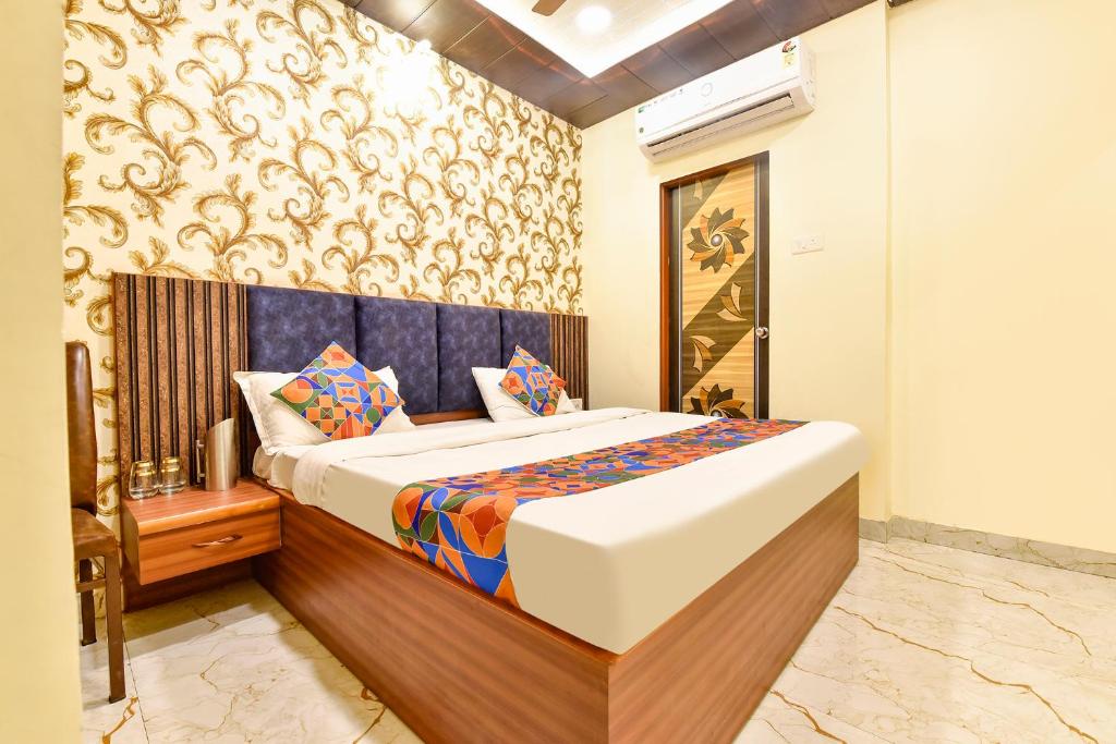 a bedroom with a bed in a room at FabHotel Spark in Jaipur