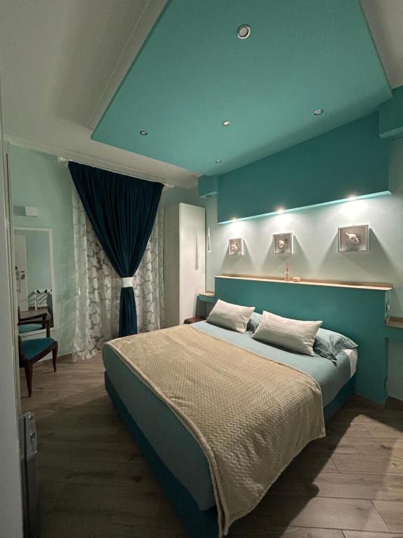 Katil atau katil-katil dalam bilik di Ambramarina B&B