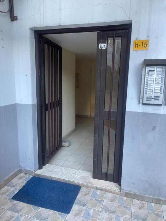 an open door of a building with a door sidx sidx at Gega Apartment in Shkodër