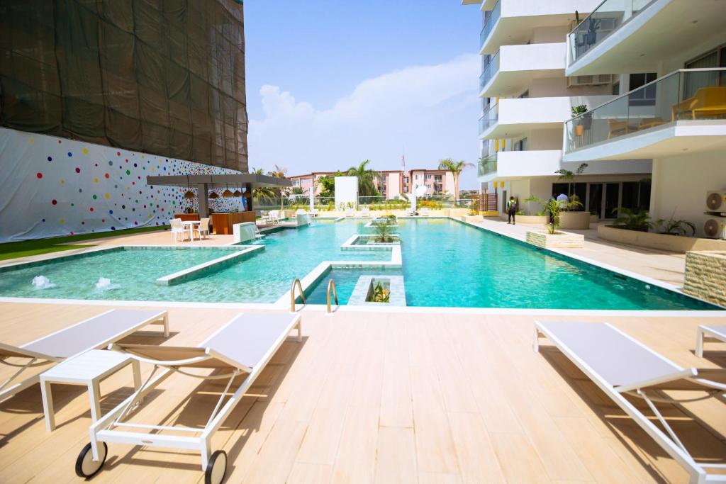 a swimming pool in the middle of a building at The Pavilion 1BDR Luxury Apt in Accra