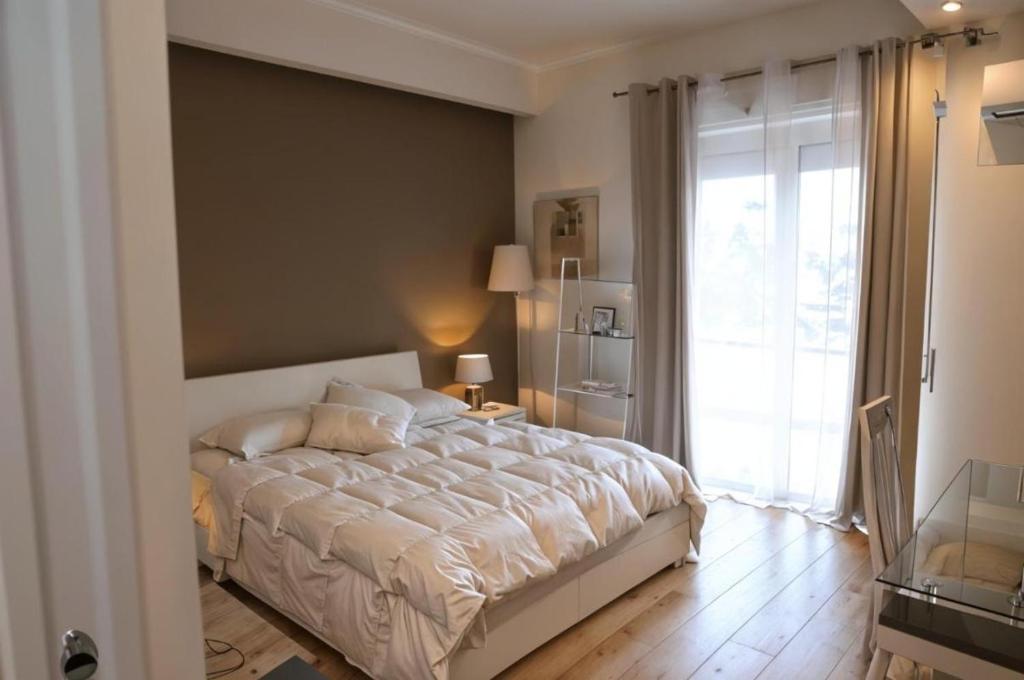 Ένα ή περισσότερα κρεβάτια σε δωμάτιο στο Suite Strasburgo 253