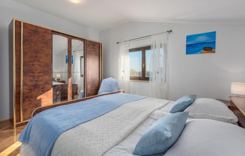Postel nebo postele na pokoji v ubytování Apartmani Katalin