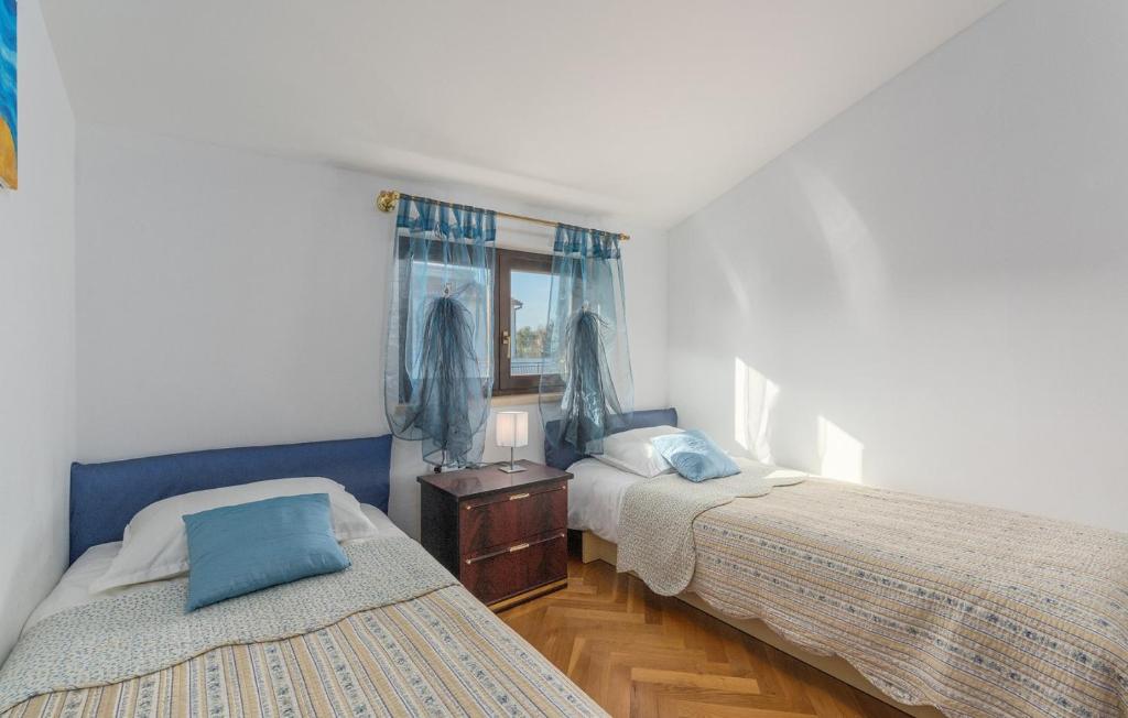 Postel nebo postele na pokoji v ubytování Apartmani Katalin