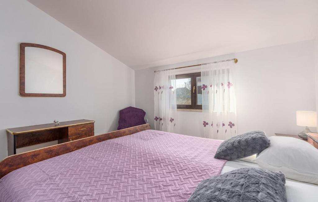 Postel nebo postele na pokoji v ubytování Apartmani Katalin