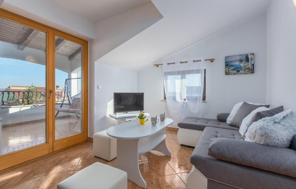 TV a/nebo společenská místnost v ubytování Apartmani Katalin
