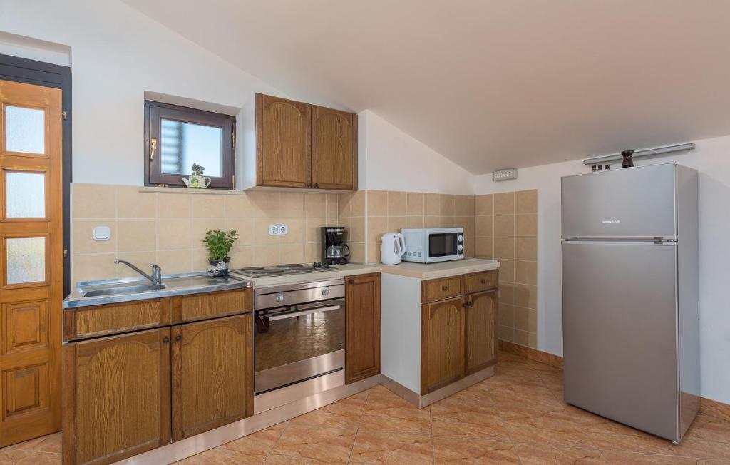 Kuchyň nebo kuchyňský kout v ubytování Apartmani Katalin