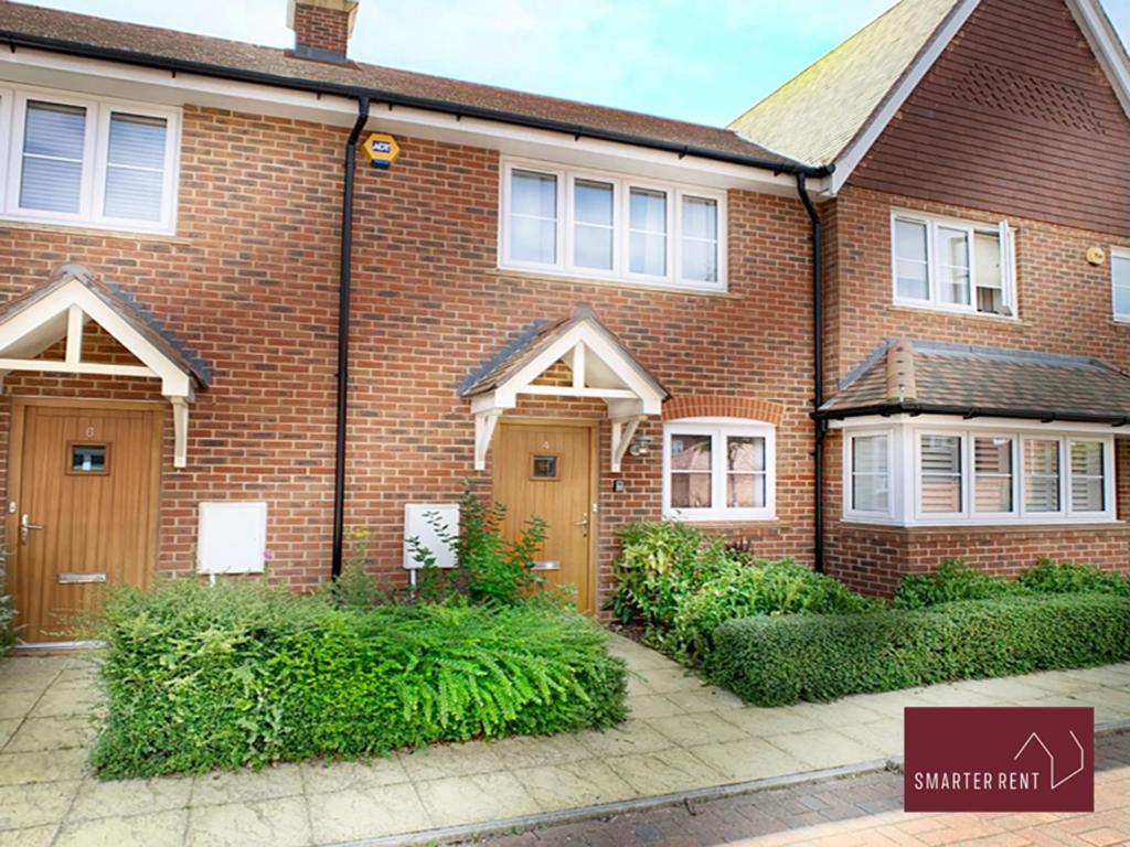 a red brick house with at Wokingham - 2 Bed House with parking and garden in Wokingham