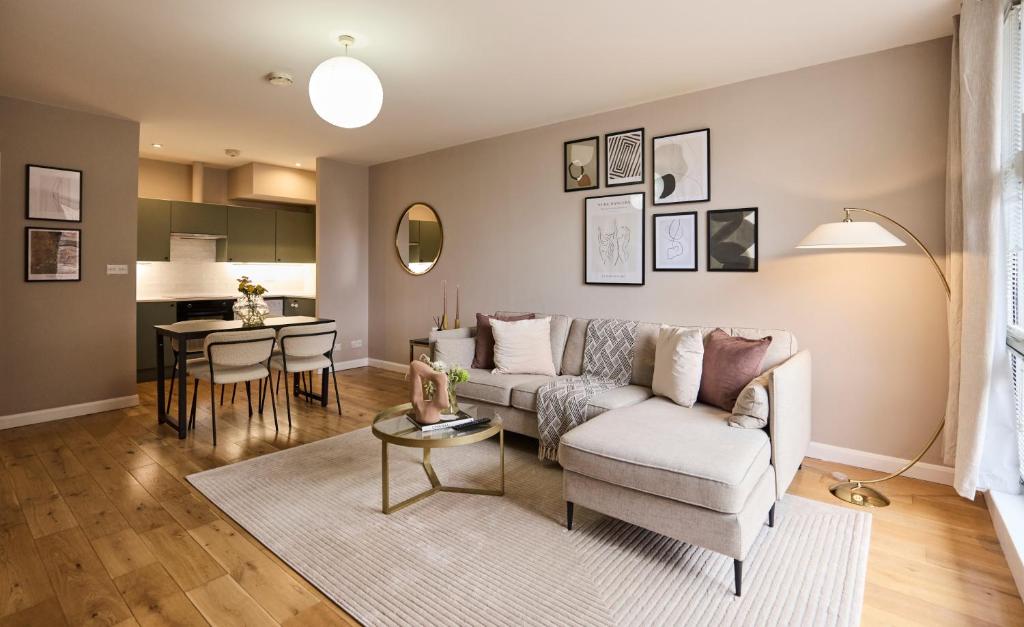 a living room with a couch and a table at The Deptford Hideout - Lovely 1BDR Flat in London