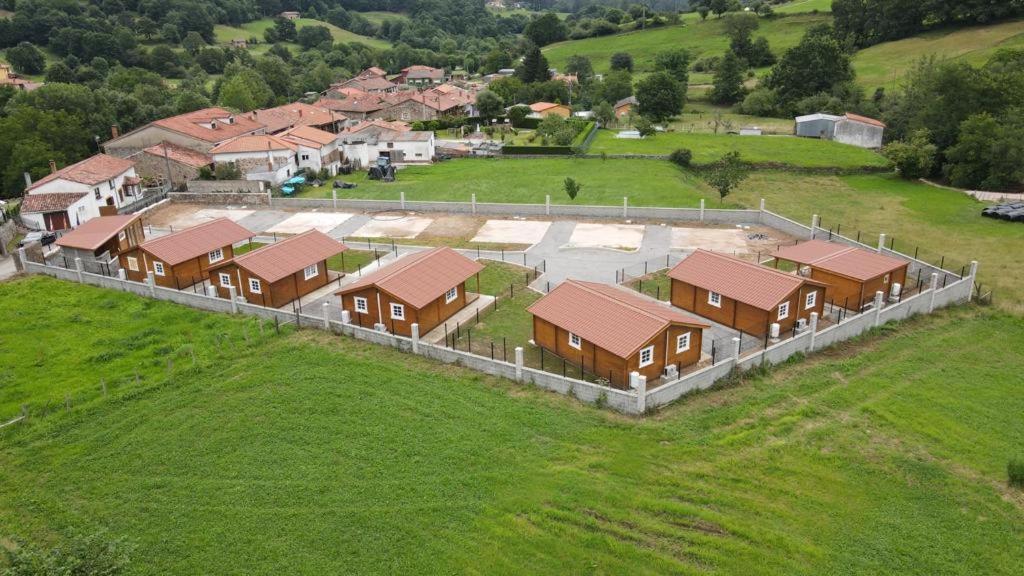 an aerial view of a house in a field at BUNGALOWS MARTINA in Coó