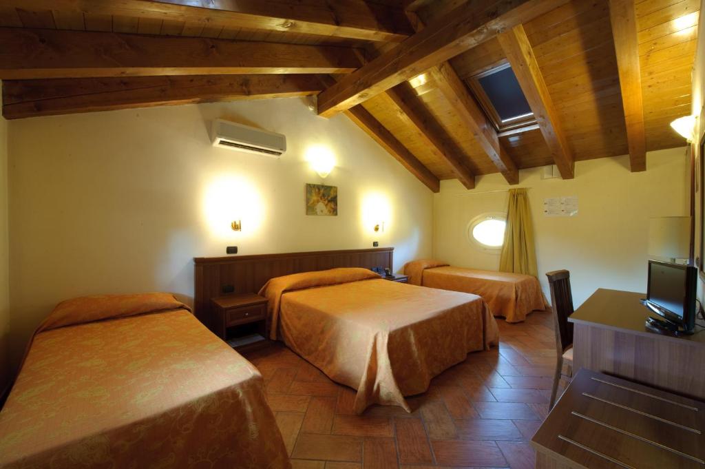 Säng eller sängar i ett rum på Corte Degli Estensi