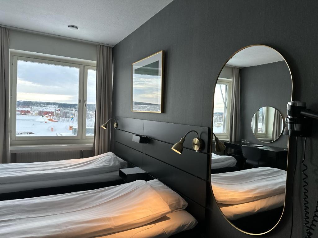 Postel nebo postele na pokoji v ubytování Hotel Victoria