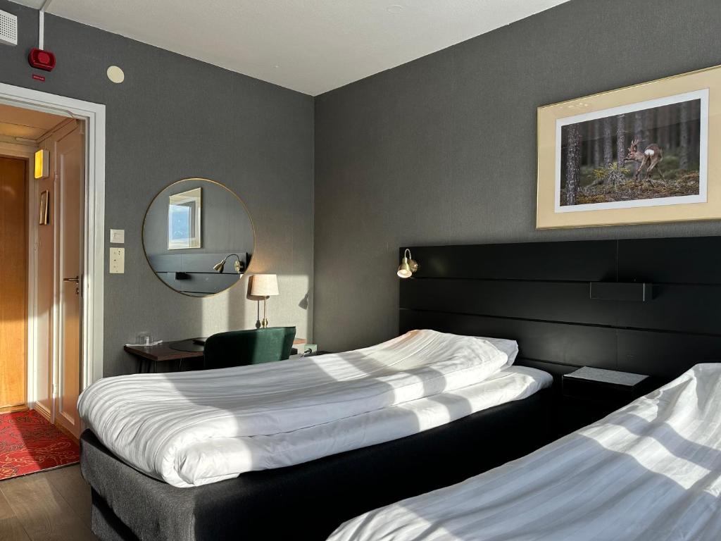 Postel nebo postele na pokoji v ubytování Hotel Victoria