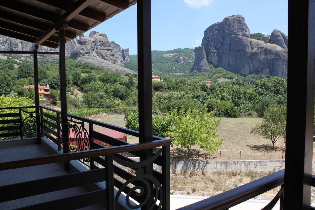 a balcony with a view of the mountains at Grand Meteora Hotel in Kalabaka