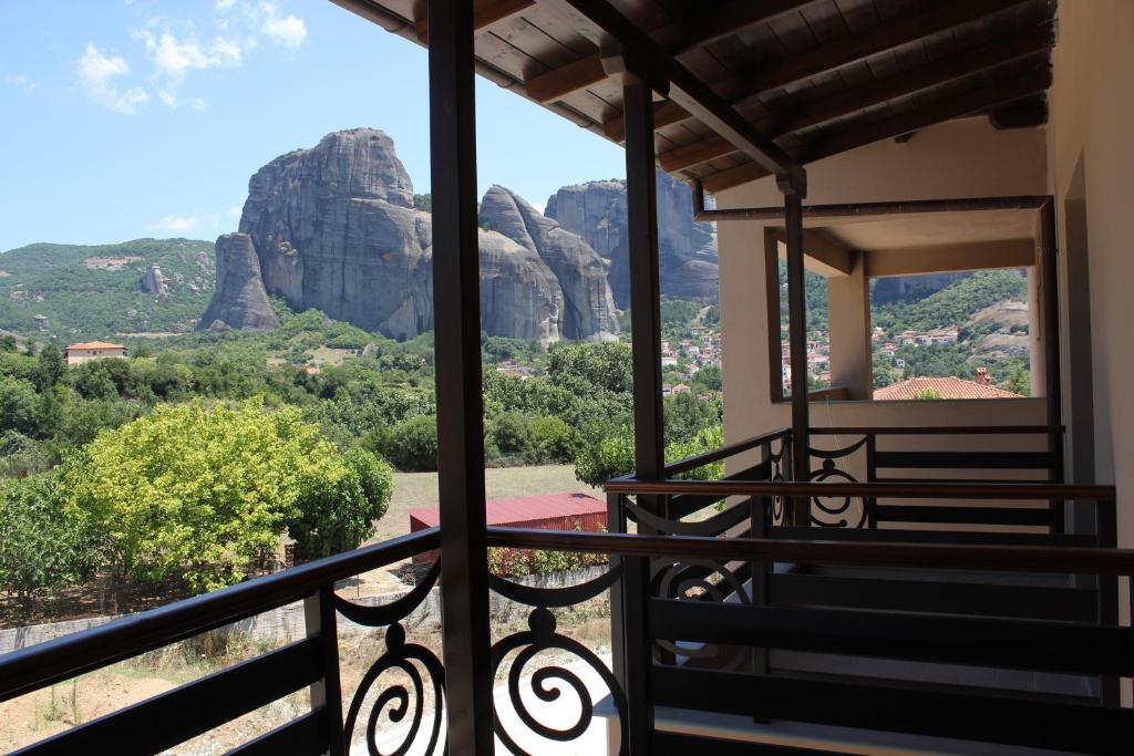 a balcony with a view of the mountains at Grand Meteora Hotel in Kalabaka