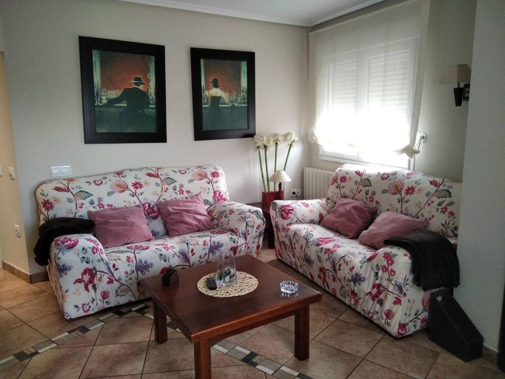 a living room with two couches and a table at 3 bedrooms apartement at Bronchales in Bronchales