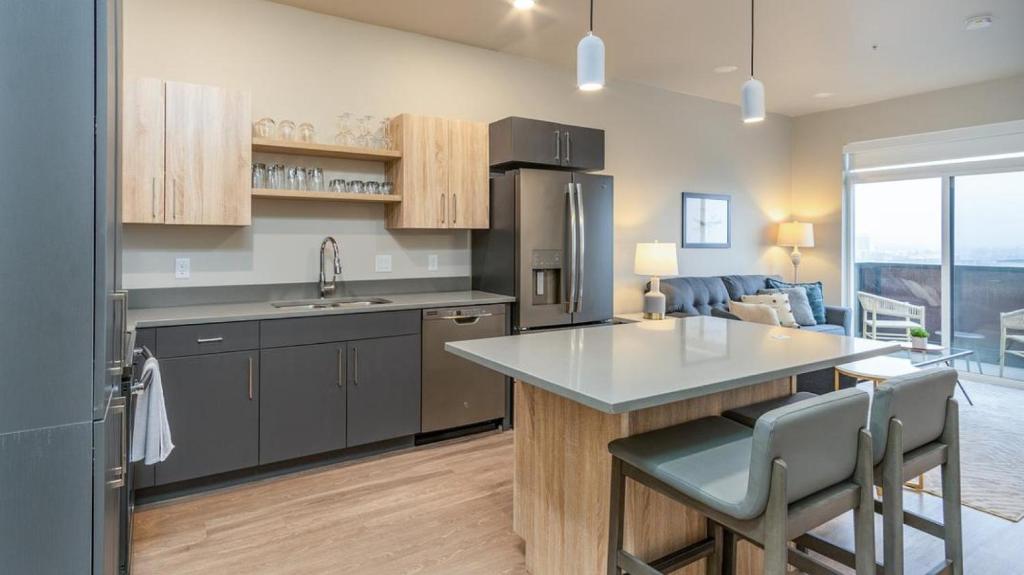 a kitchen with a kitchen island with a counter top at Landing Modern Apartment with Amazing Amenities (ID2709X55) in Salt Lake City