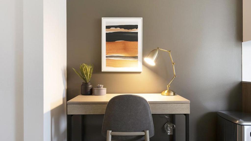 a desk with a chair and a lamp and a picture at Landing Modern Apartment with Amazing Amenities (ID9822X42) in Portland