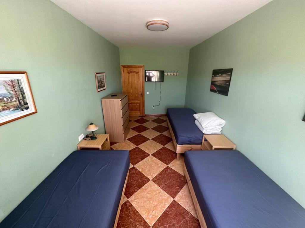 Postel nebo postele na pokoji v ubytování Moto Vila Groot
