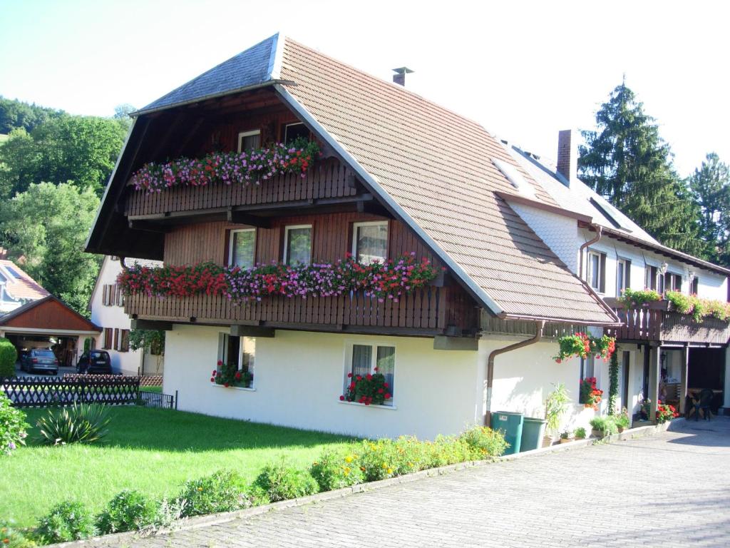 a house with flower boxes on the front of it at Fischerhäusle in Oberried