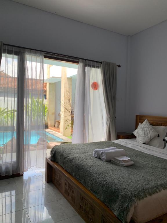 Postel nebo postele na pokoji v ubytování Chua Guest house Canggu