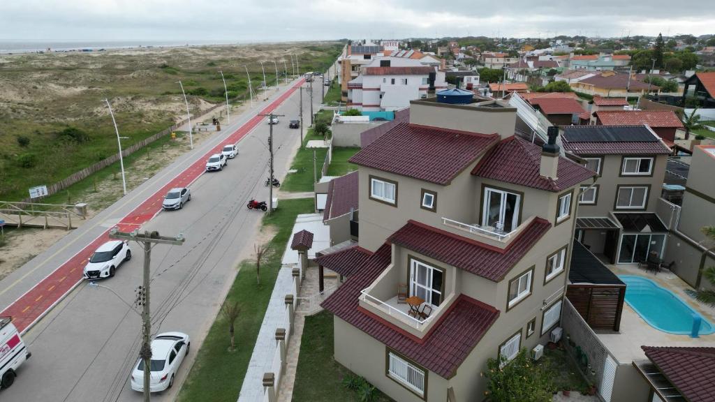 a view of a street and a house at Pousada Vista da Barra in Cassino