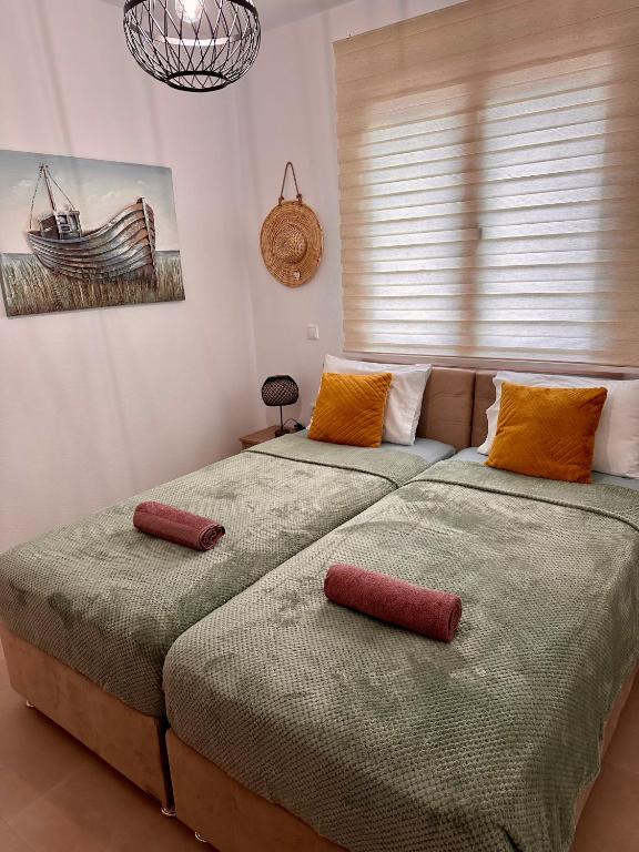 Кровать или кровати в номере Anemos Villa Stegna