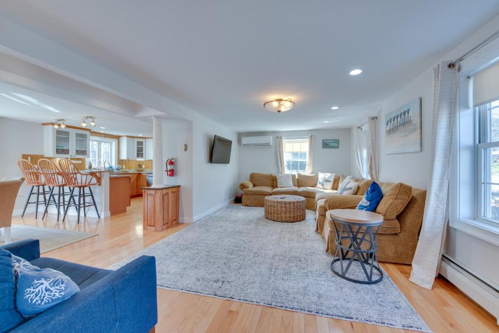 a living room with a couch and a table at Downtown Ogunquit Home 1 Mi to Beach! in Ogunquit