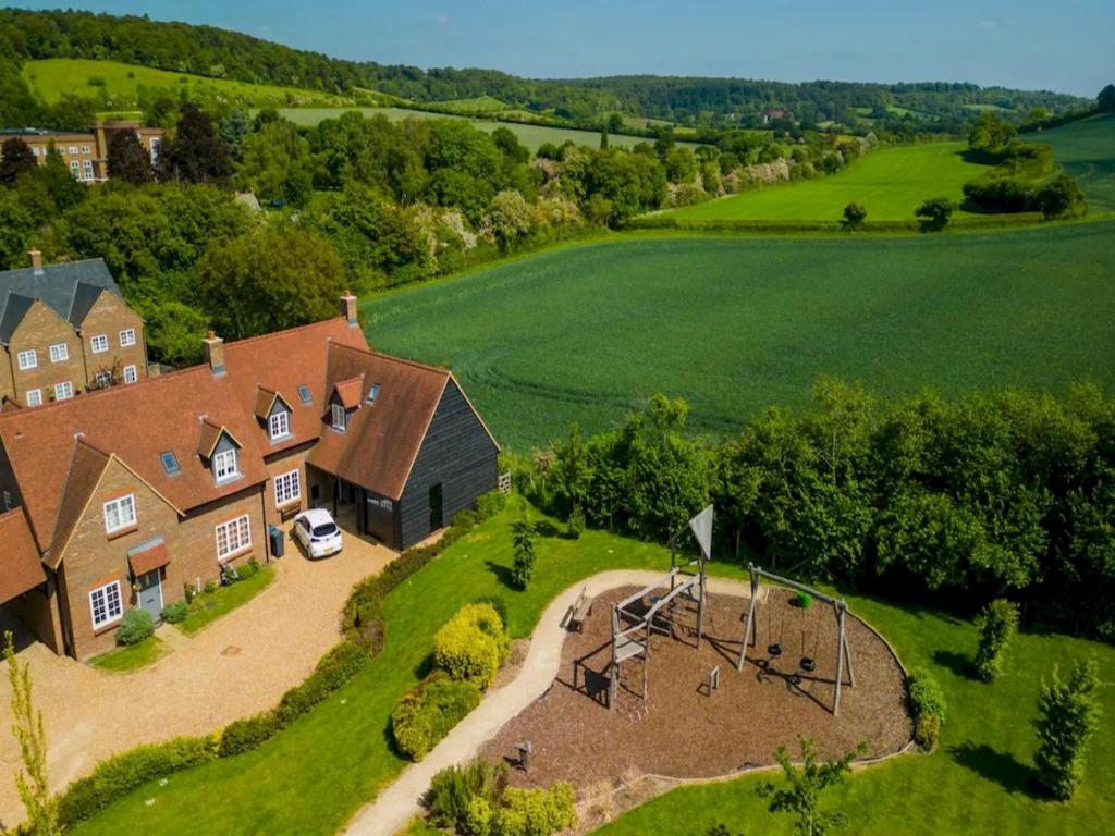 an aerial view of a house with a playground at Pass the Keys Bright Spacious Chilterns Hideaway in Saunderton