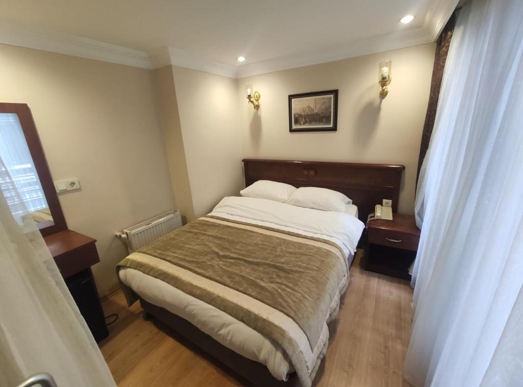 Postel nebo postele na pokoji v ubytování Hotel Akyildiz