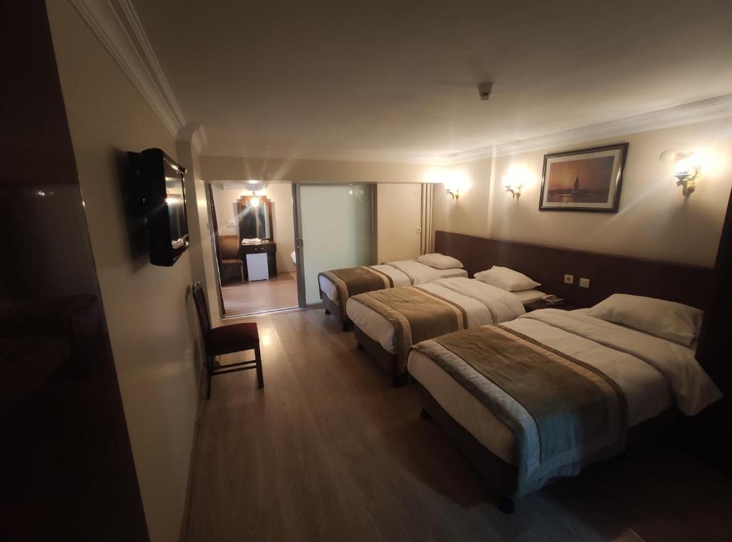 Postel nebo postele na pokoji v ubytování Hotel Akyildiz