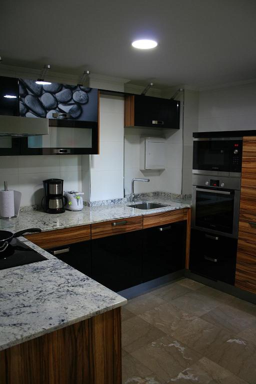 Kuchyň nebo kuchyňský kout v ubytování Acà Y Allà Apartamento Alfonso El Batallador