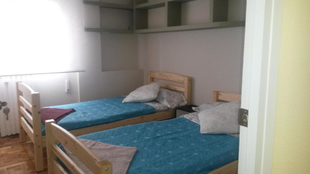 Postel nebo postele na pokoji v ubytování Acà Y Allà Apartamento Alfonso El Batallador