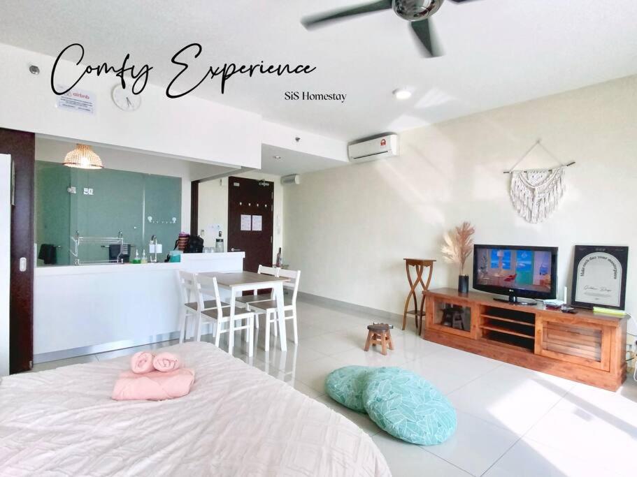 a living room with a bed and a tv at GreeneryHome 1-4pax Trefoil Studio Setia Alam in Shah Alam