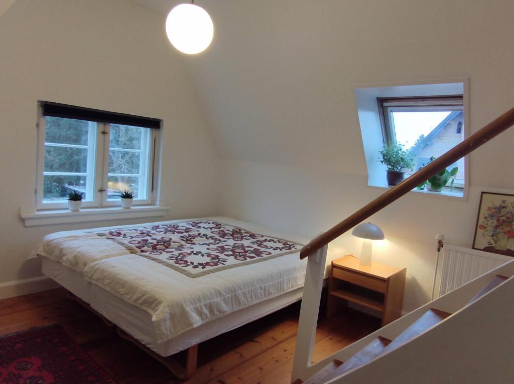 A bed or beds in a room at Gæstehus Sorø Sø