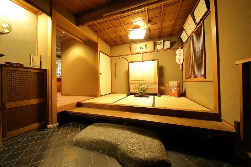 Postel nebo postele na pokoji v ubytování Ryokan Sanga