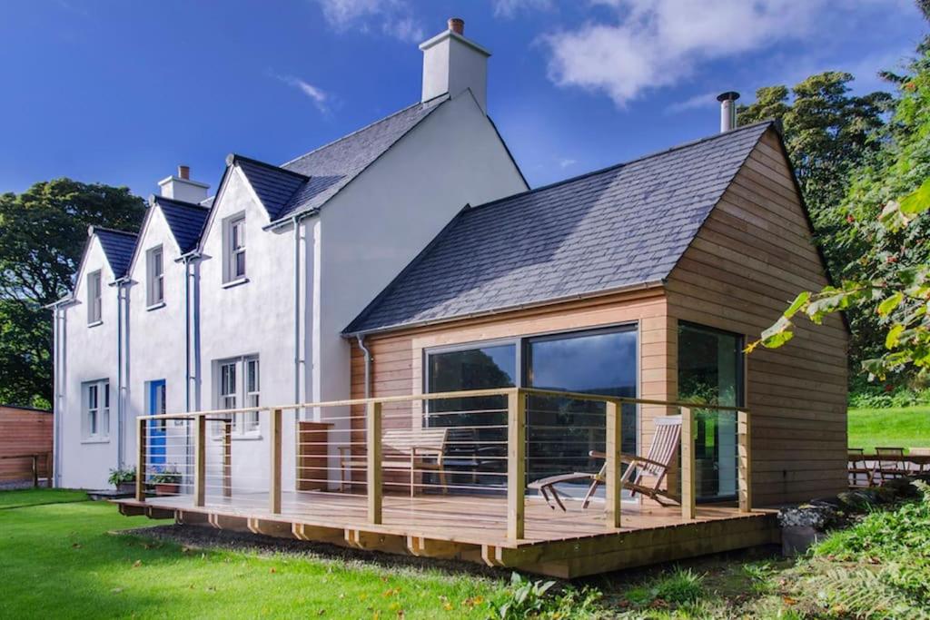 a house with a large deck in front of it at Stalker's Lodge in Perth