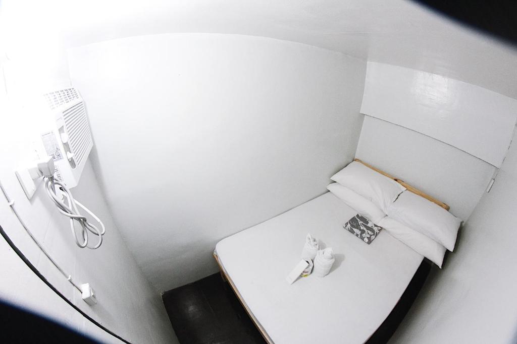 Postel nebo postele na pokoji v ubytování Dickem's Transient House