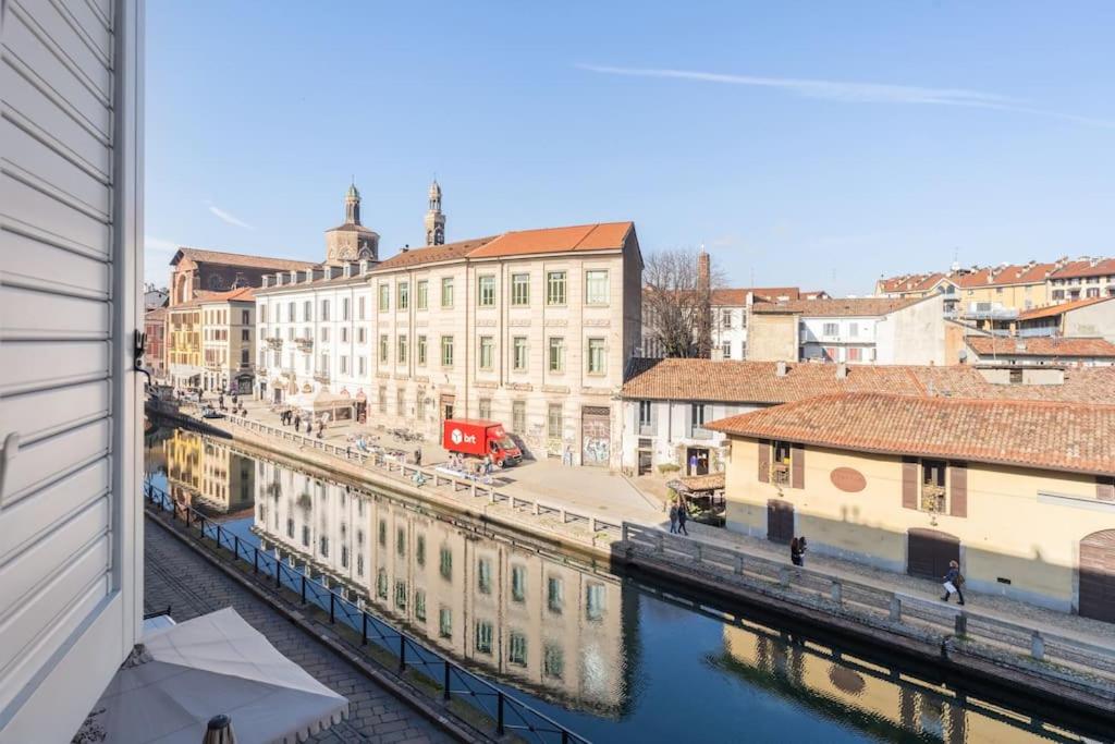 a view of a city with a river and buildings at Relax sui Navigli in Milan